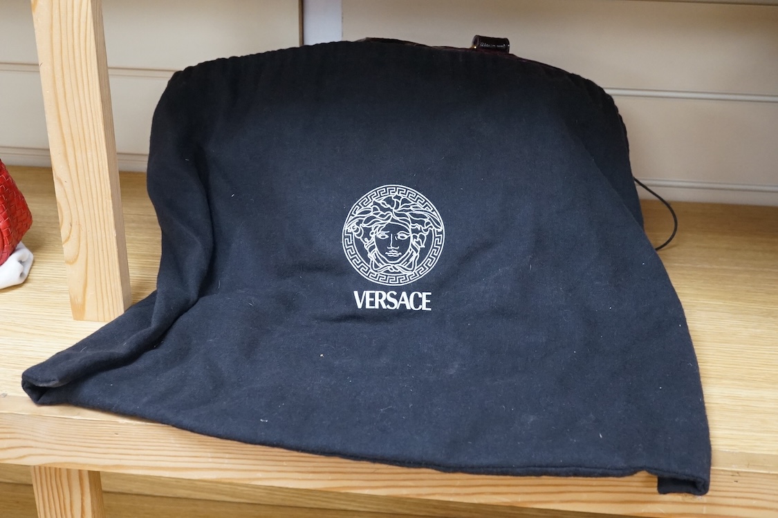 A purple patent Versace large handbag, approximately 41cm wide